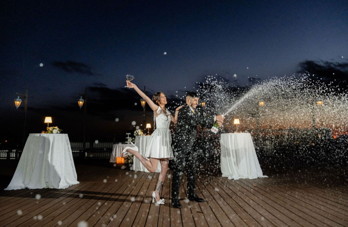 Bride and groom on the rooftop at sunset